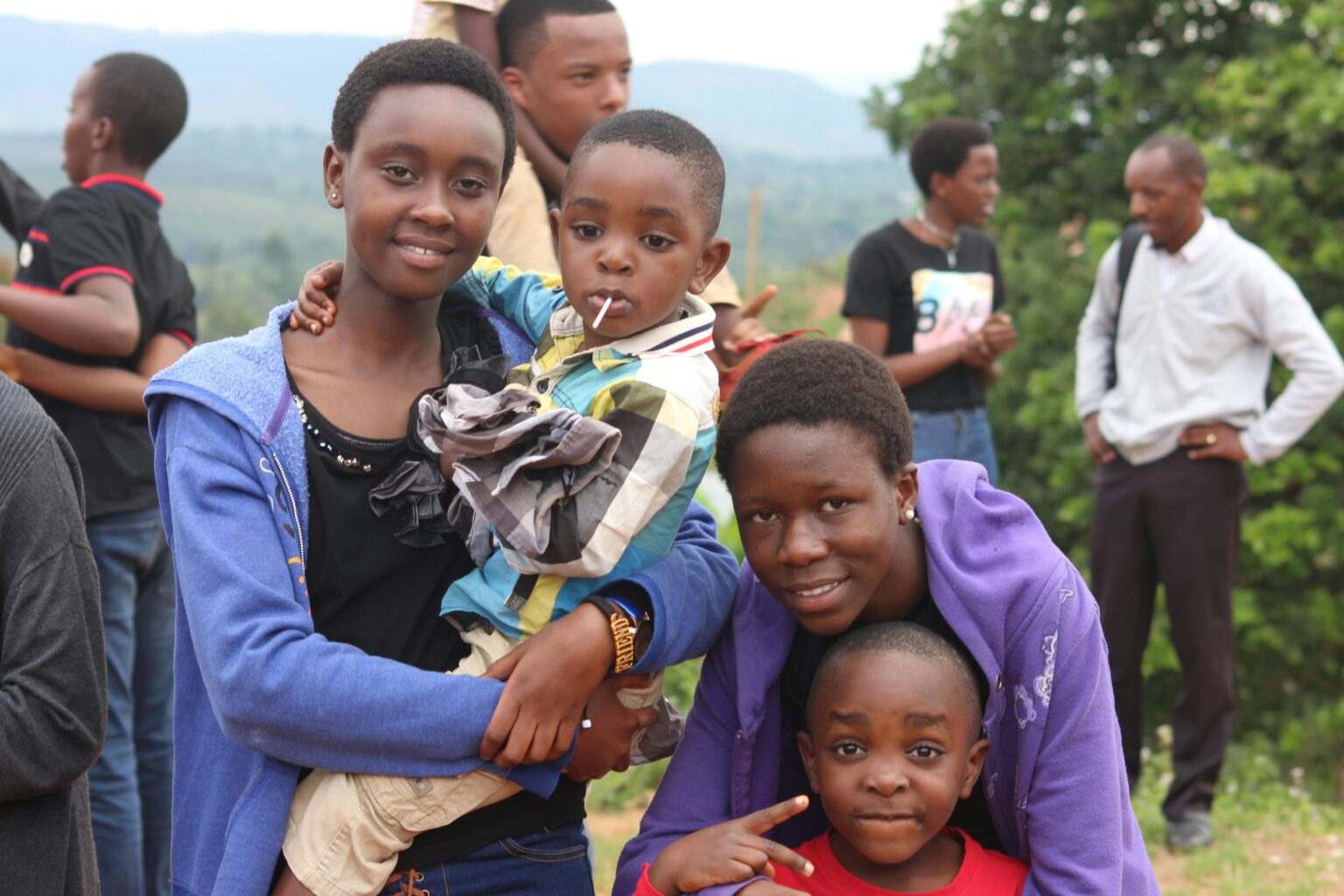 A cheerful group of friends enjoying a day outdoors in Gitega, Burundi.